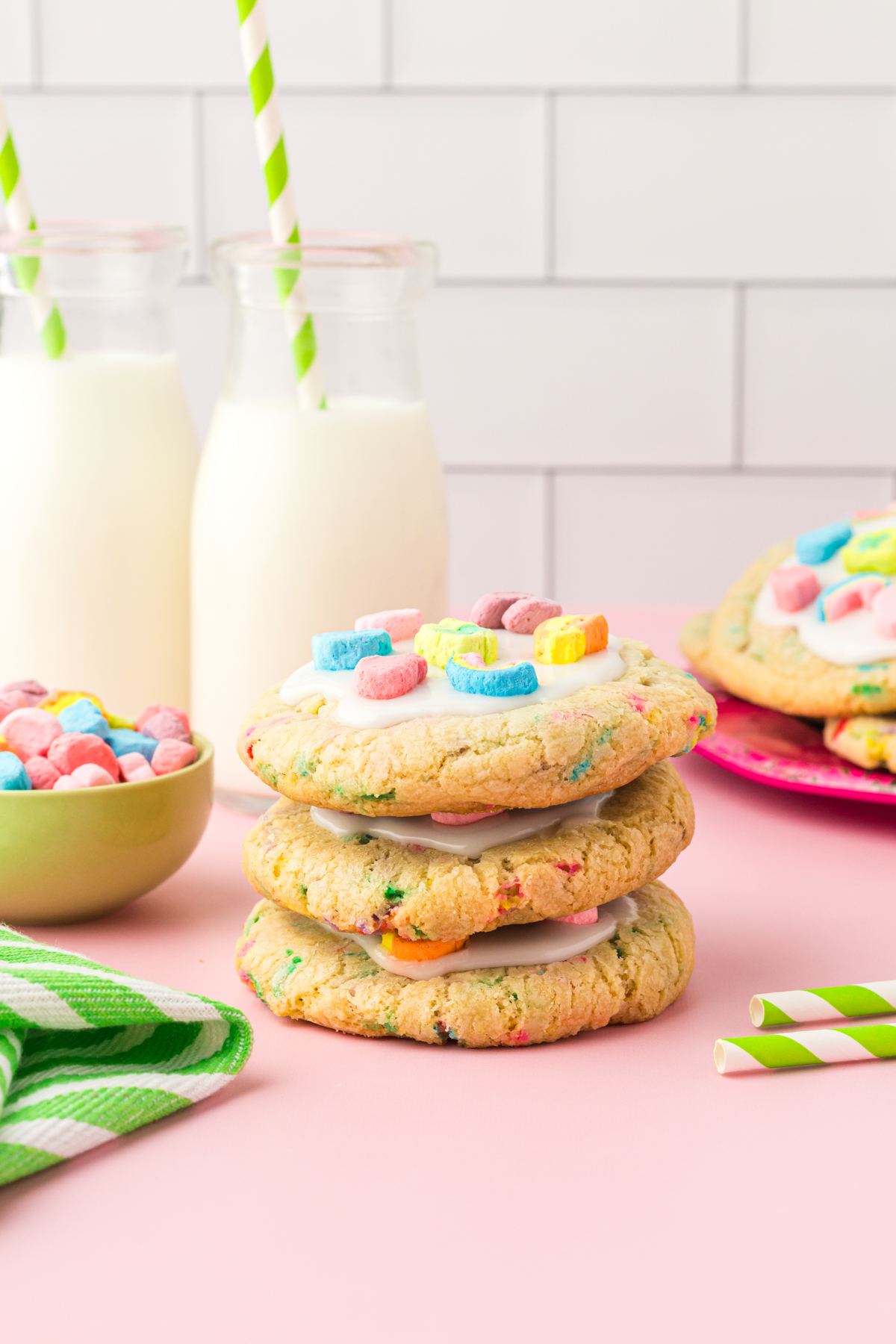 stack of Lucky Charms cookies with a glass of milk