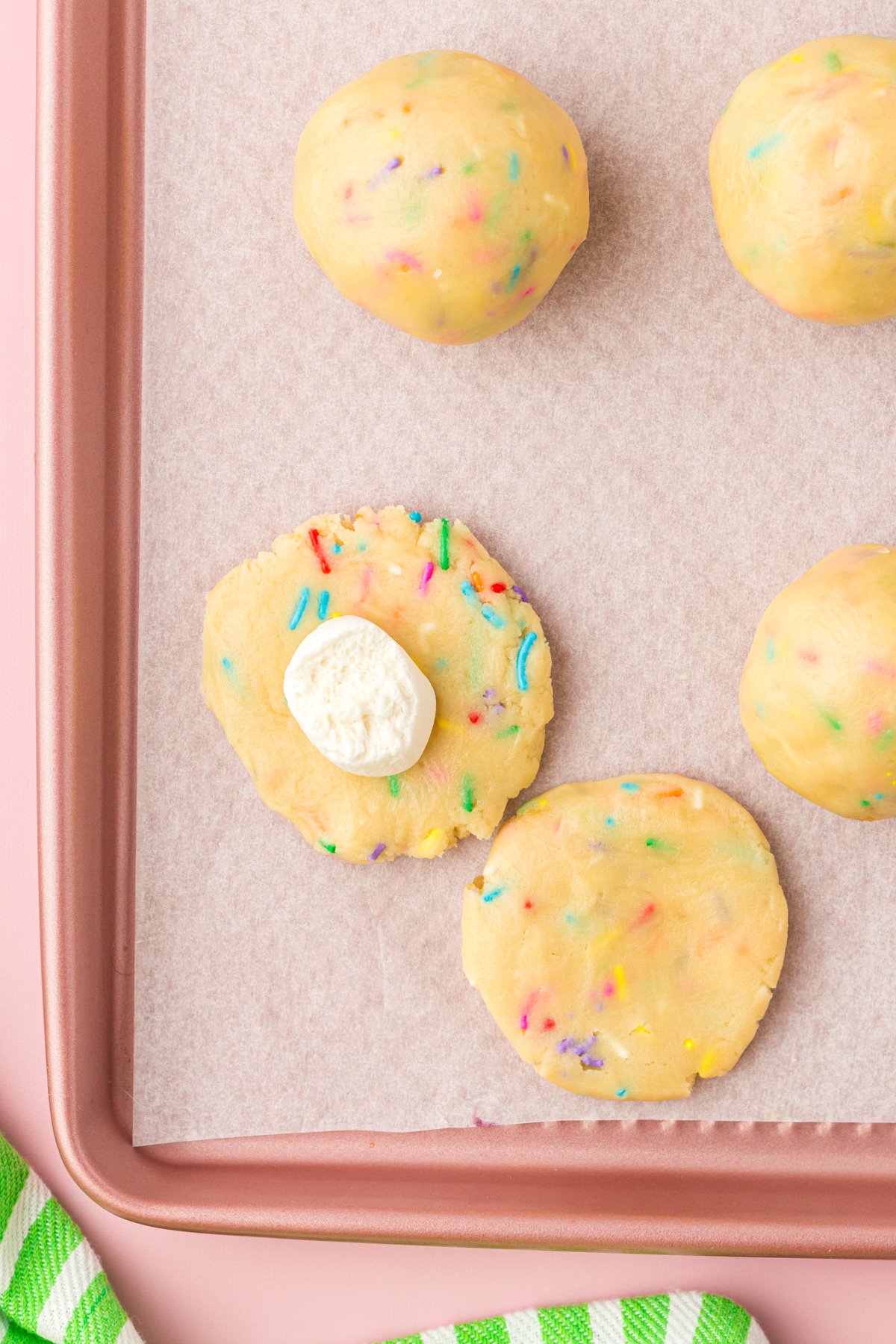 marshmallow on top of unbaked Lucky Charms cookies