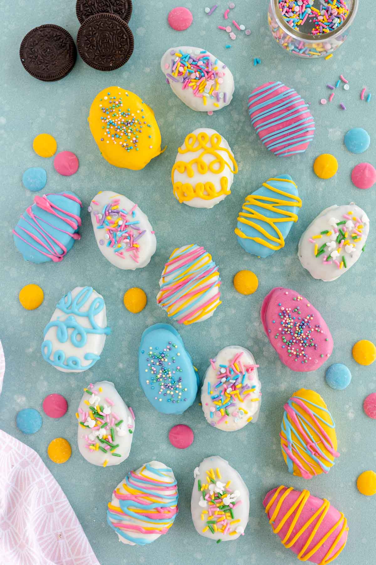 Oreo Easter eggs decorated and laying on a blue background