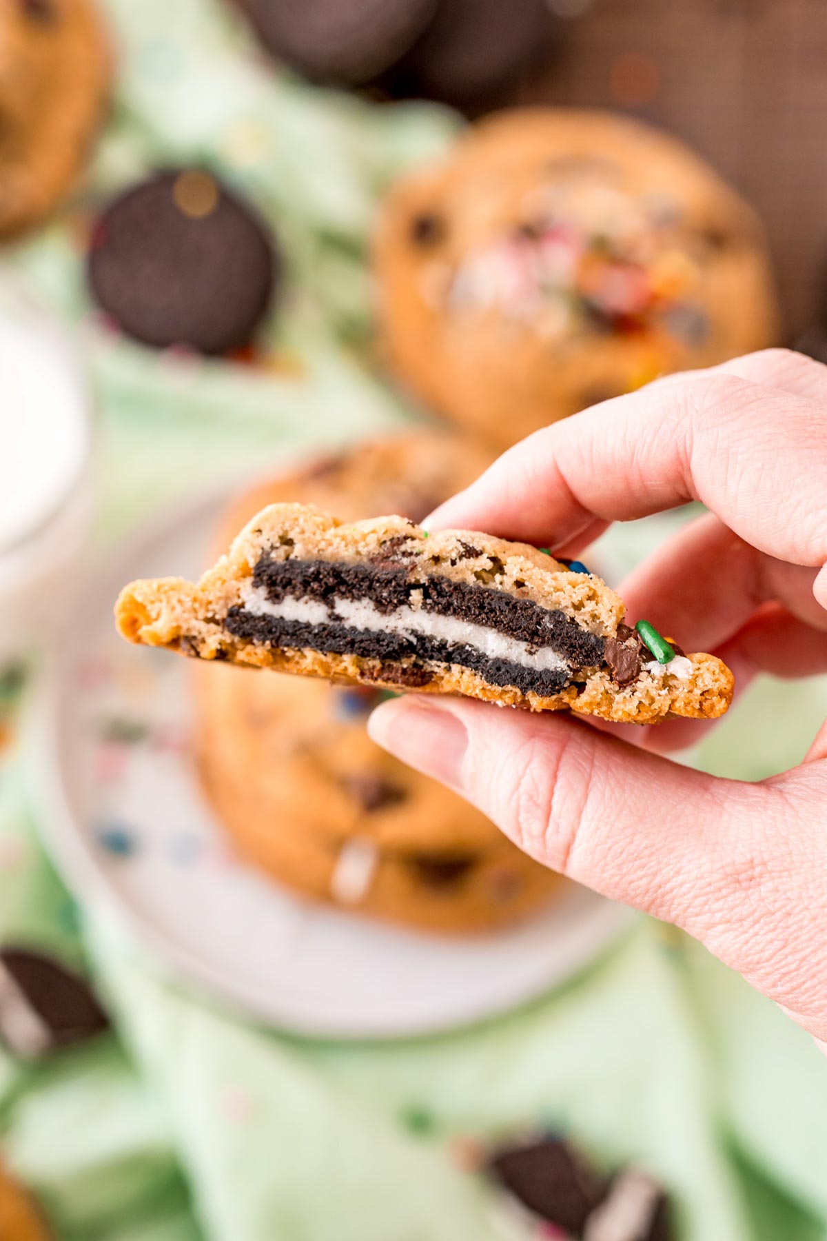 hand holding an Oreo stuffed chocolate chip cookie