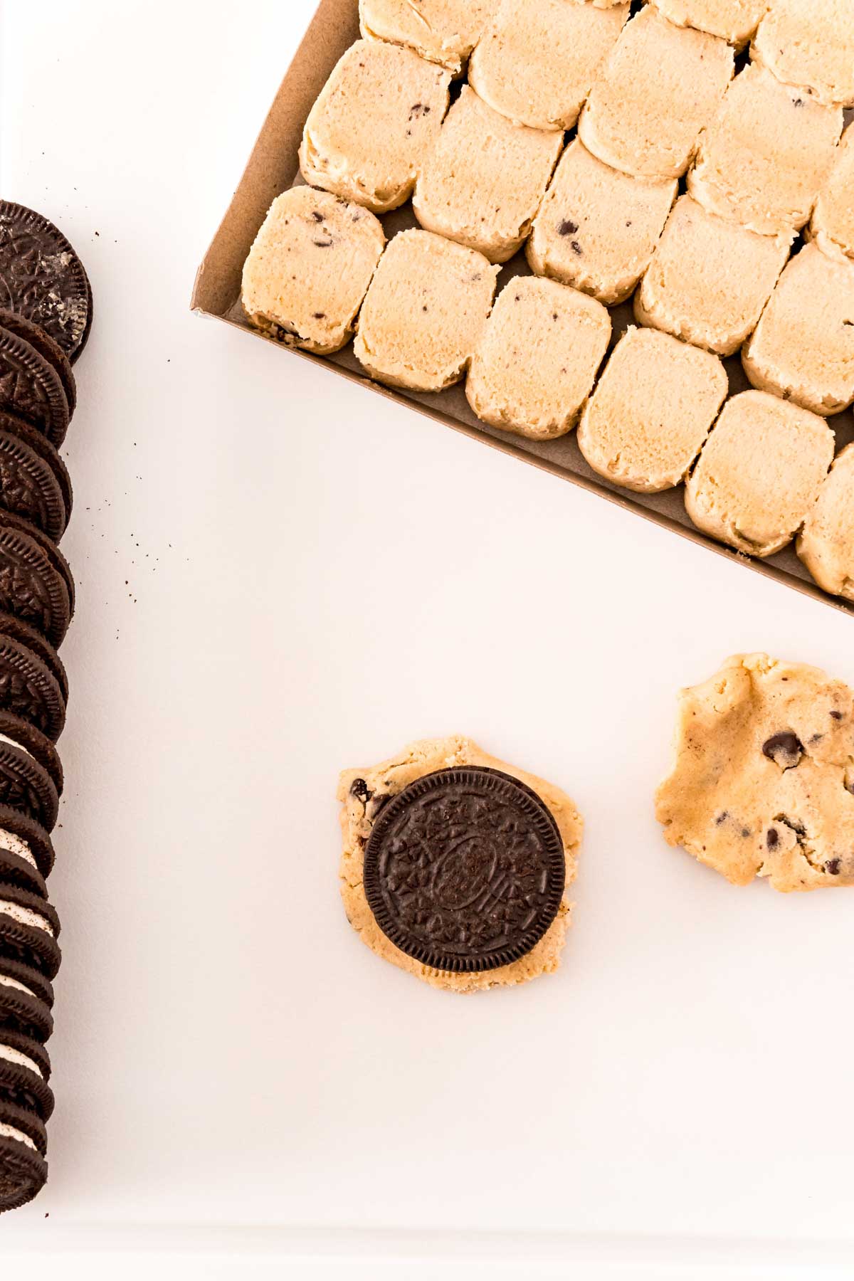 An Oreo on top of a chocolate chip cookie