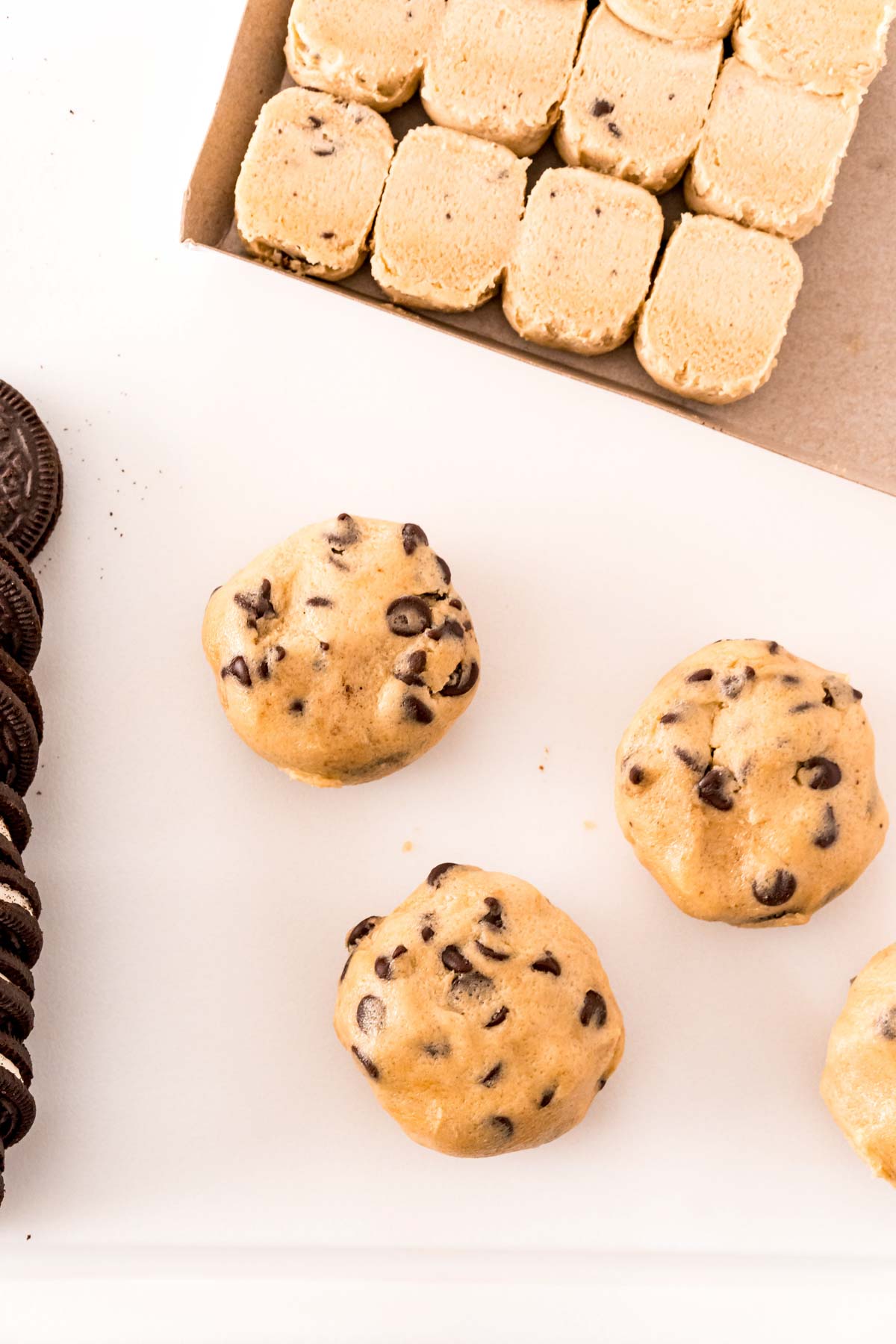 unbaked Oreo stuffed chocolate chip cookies on a baking sheet