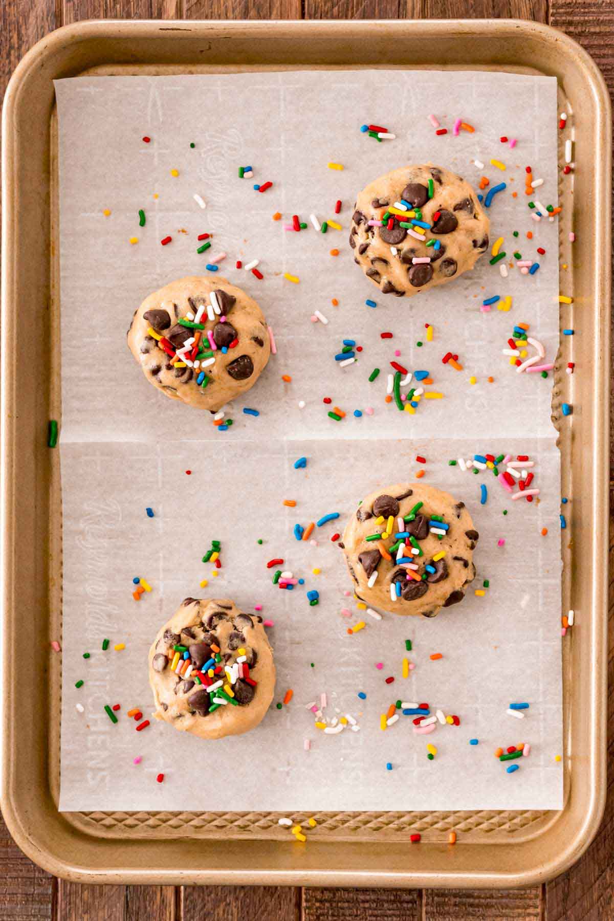 Oreo stuffed cookies with sprinkles on a baking sheet