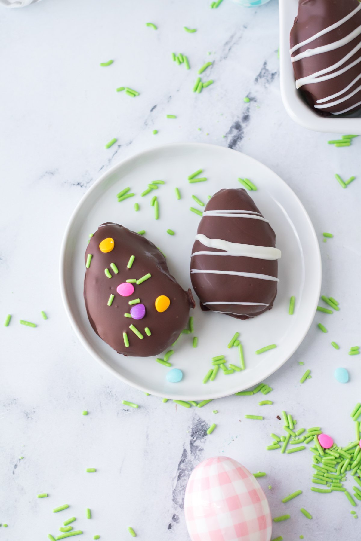 chocolate dipped peanut butter eggs on a plate