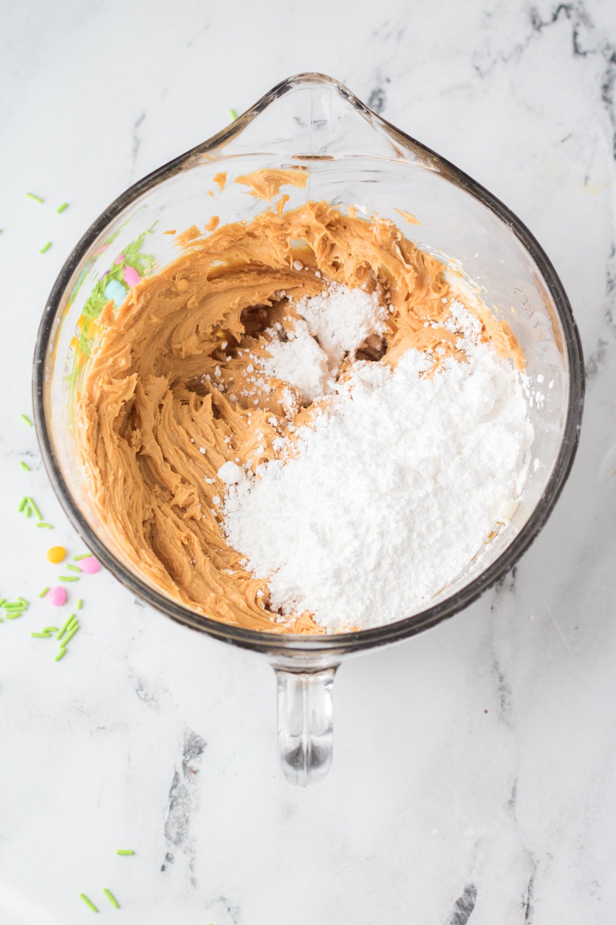 ingredients for peanut butter eggs mixed in a bowl