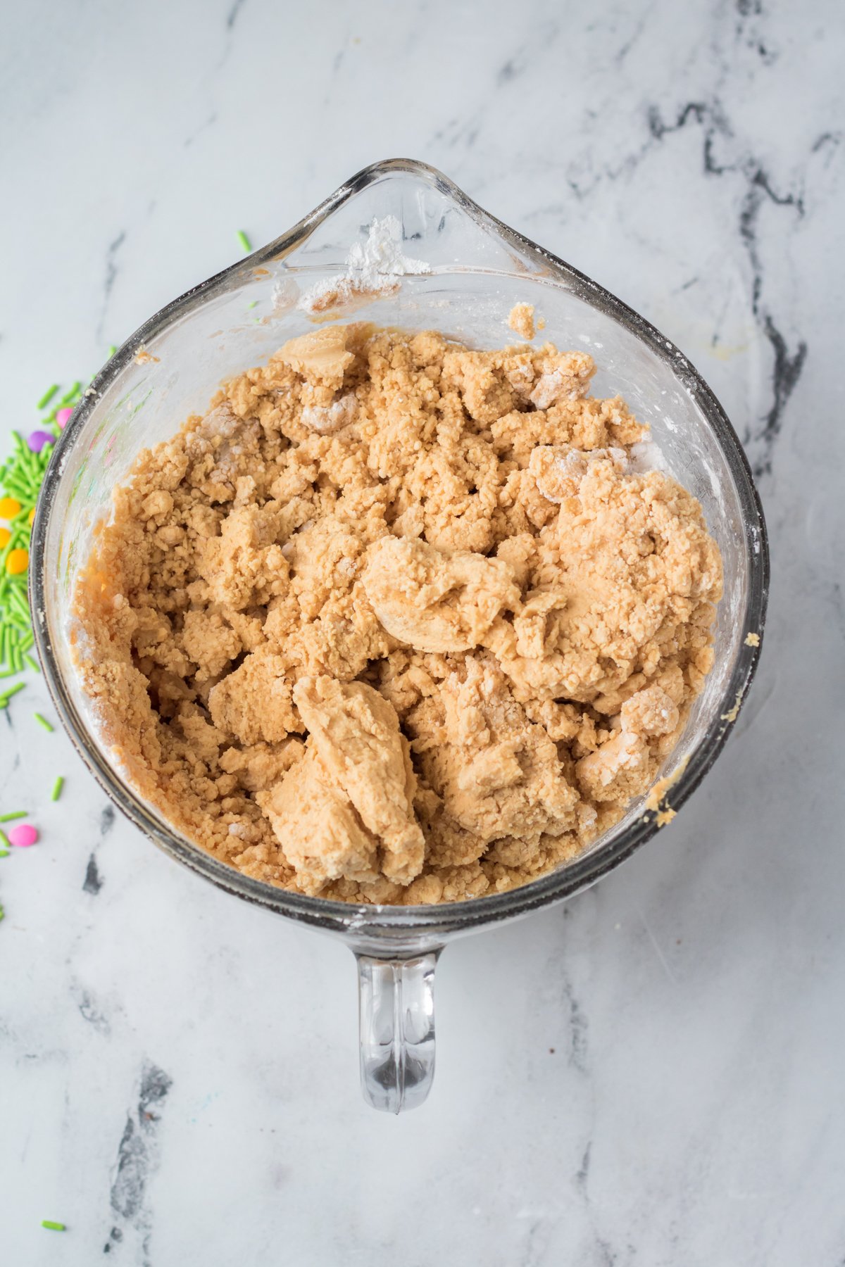 a glass bowl with peanut butter eggs batter