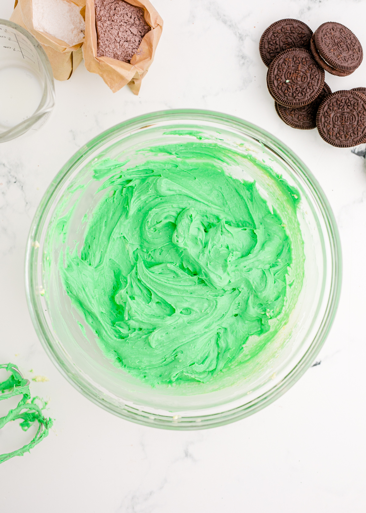 Green pudding mix in a glass bowl
