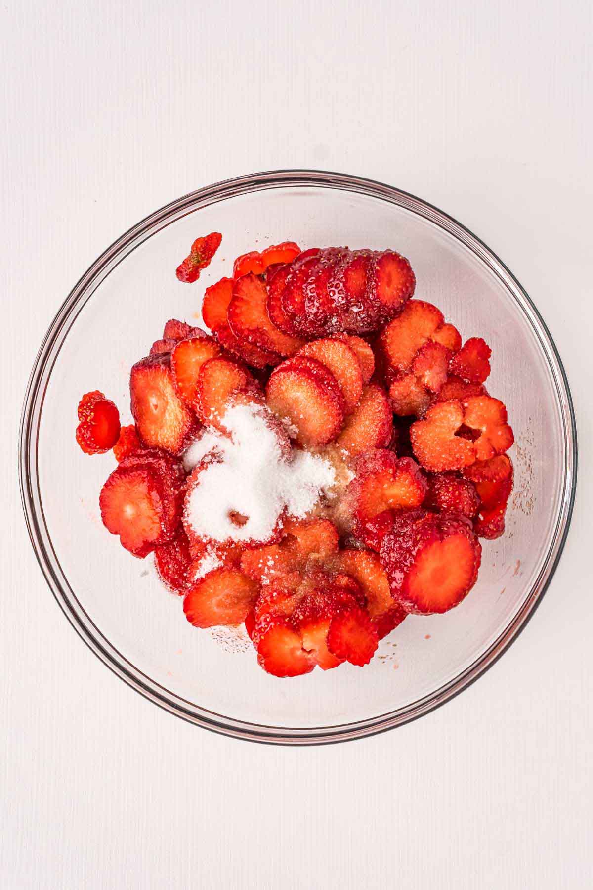 chopped strawberries in a glass bowl