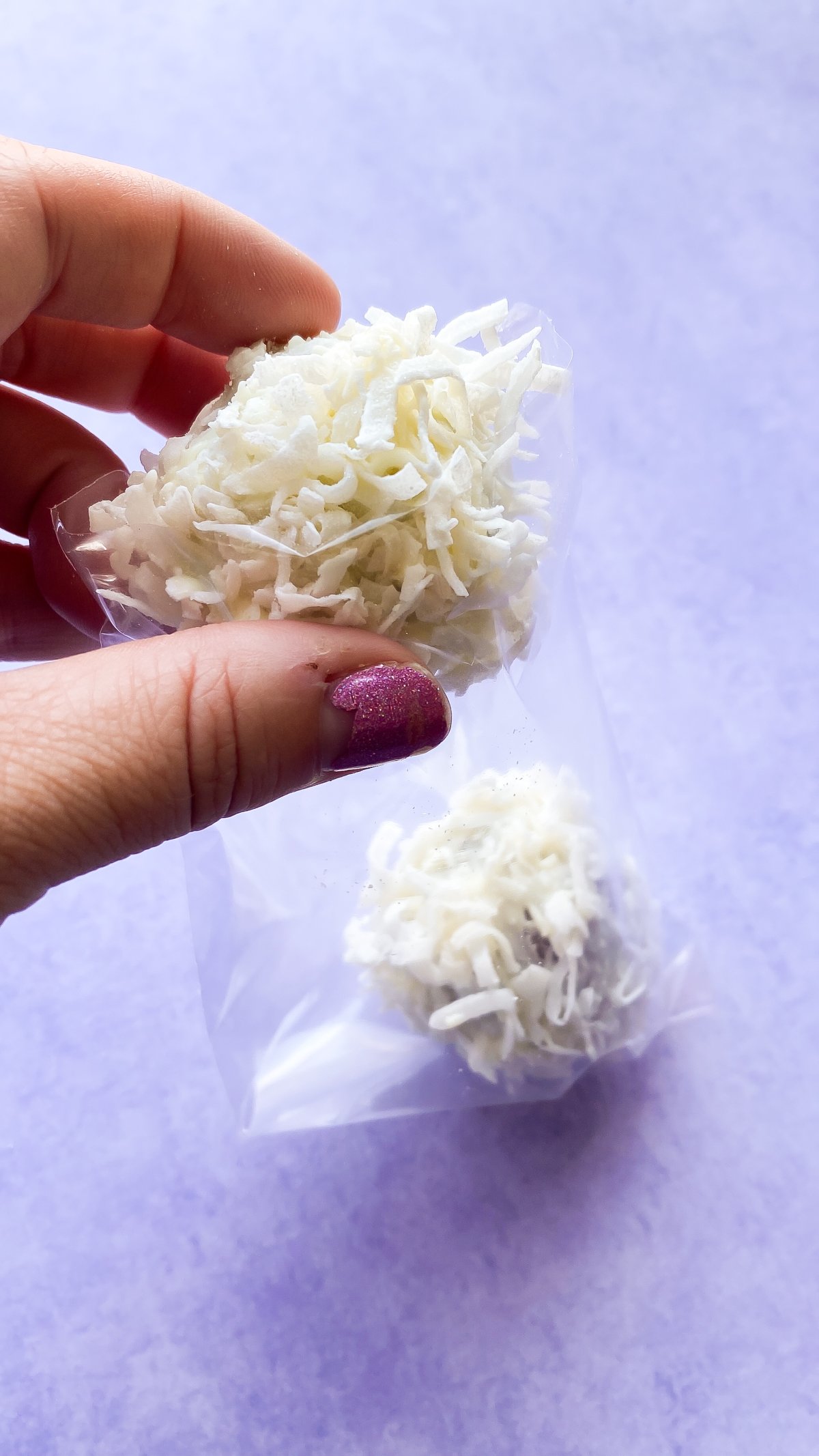 putting carrot cake balls in a treat bag