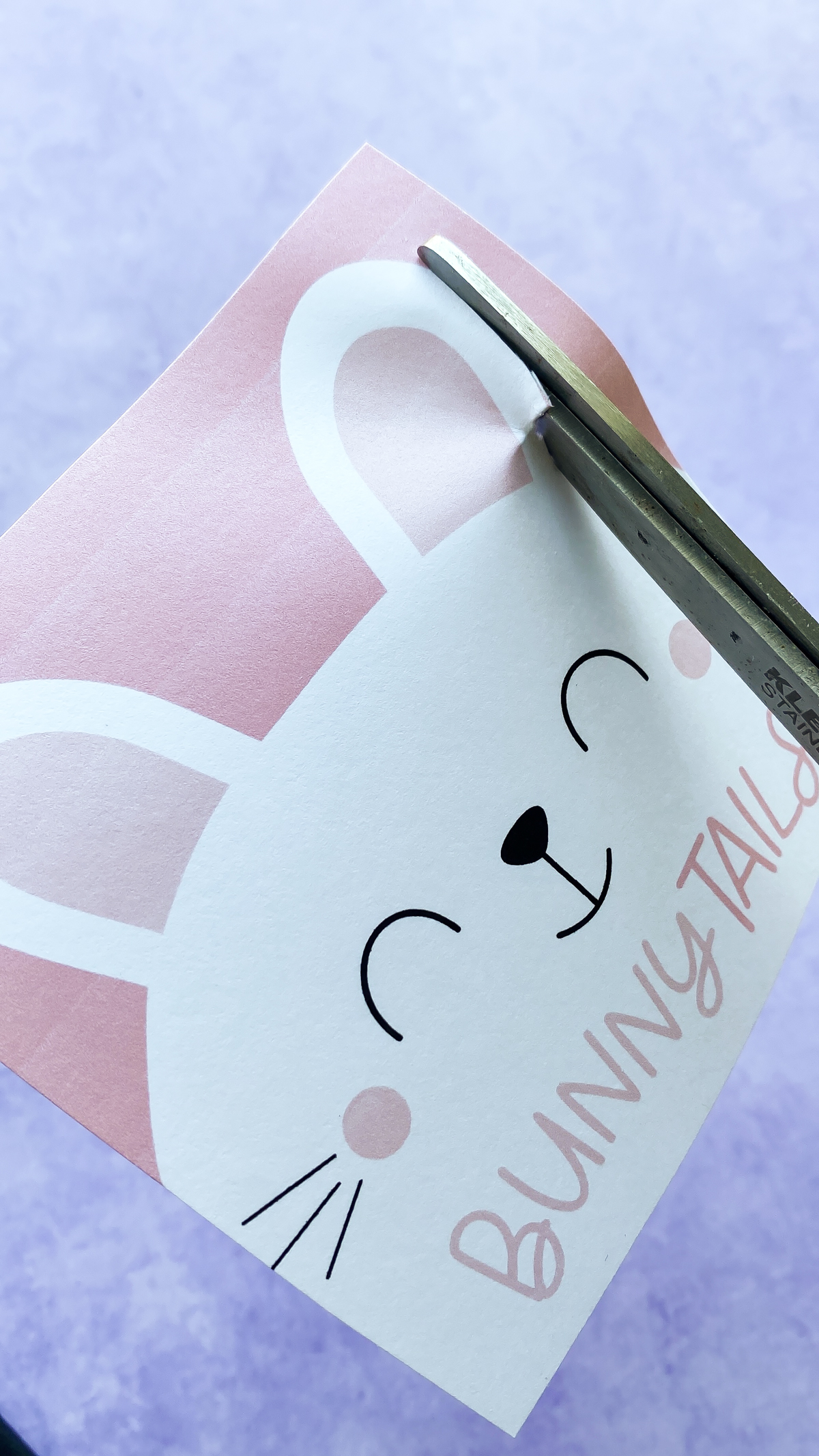 cutting out a bunny tail printable with scissors