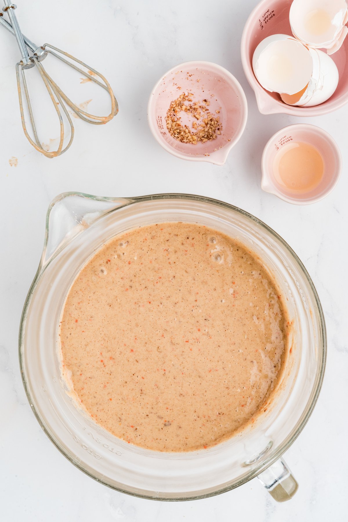 carrot cake batter in a glass bowl