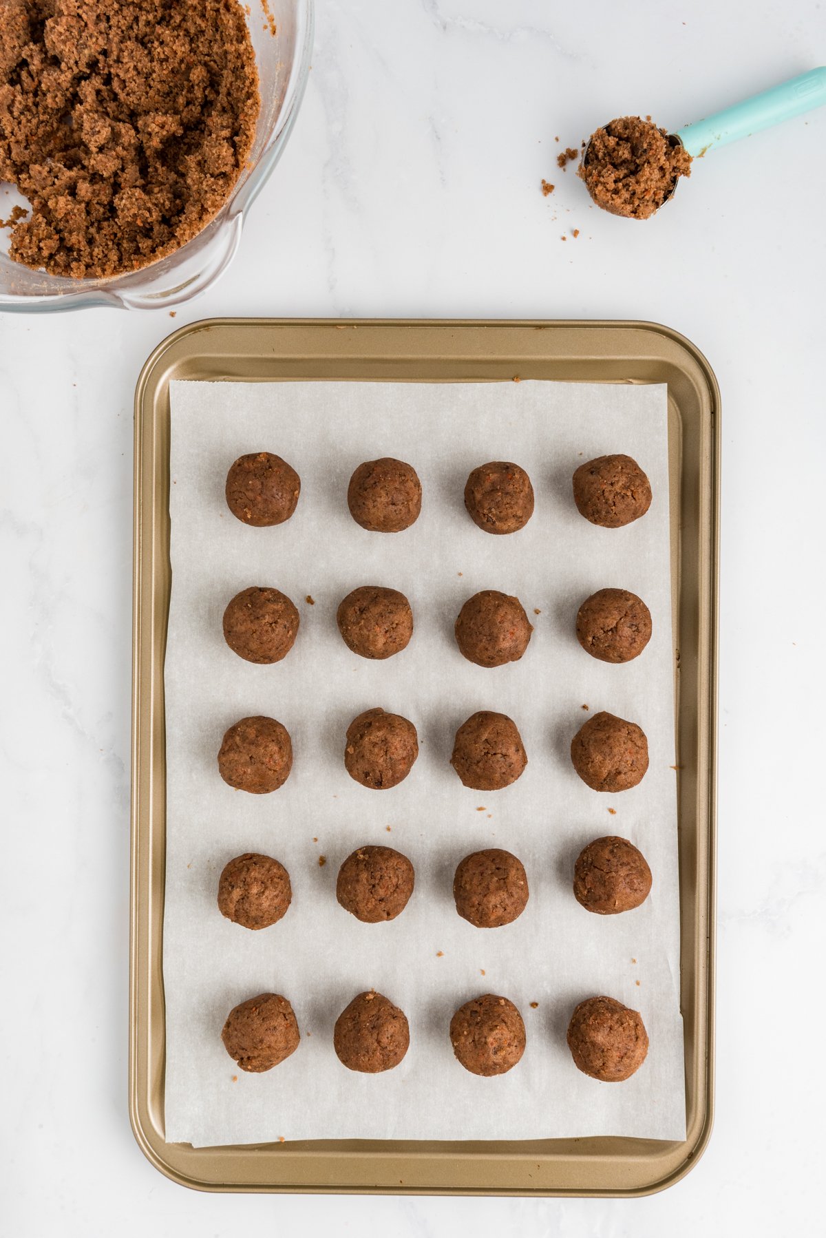 undipped carrot cake balls on a baking sheet