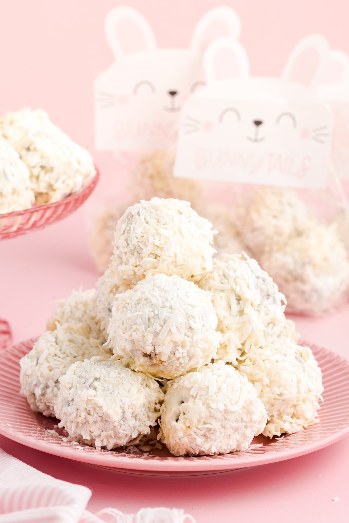 pile of carrot cake balls on a pink plate