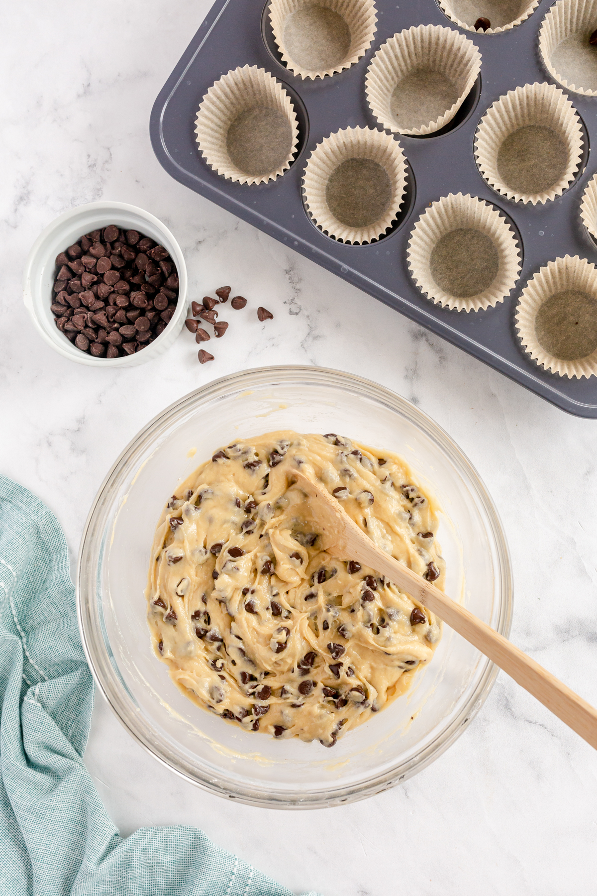 glass bowl with chocolate chip muffin batter