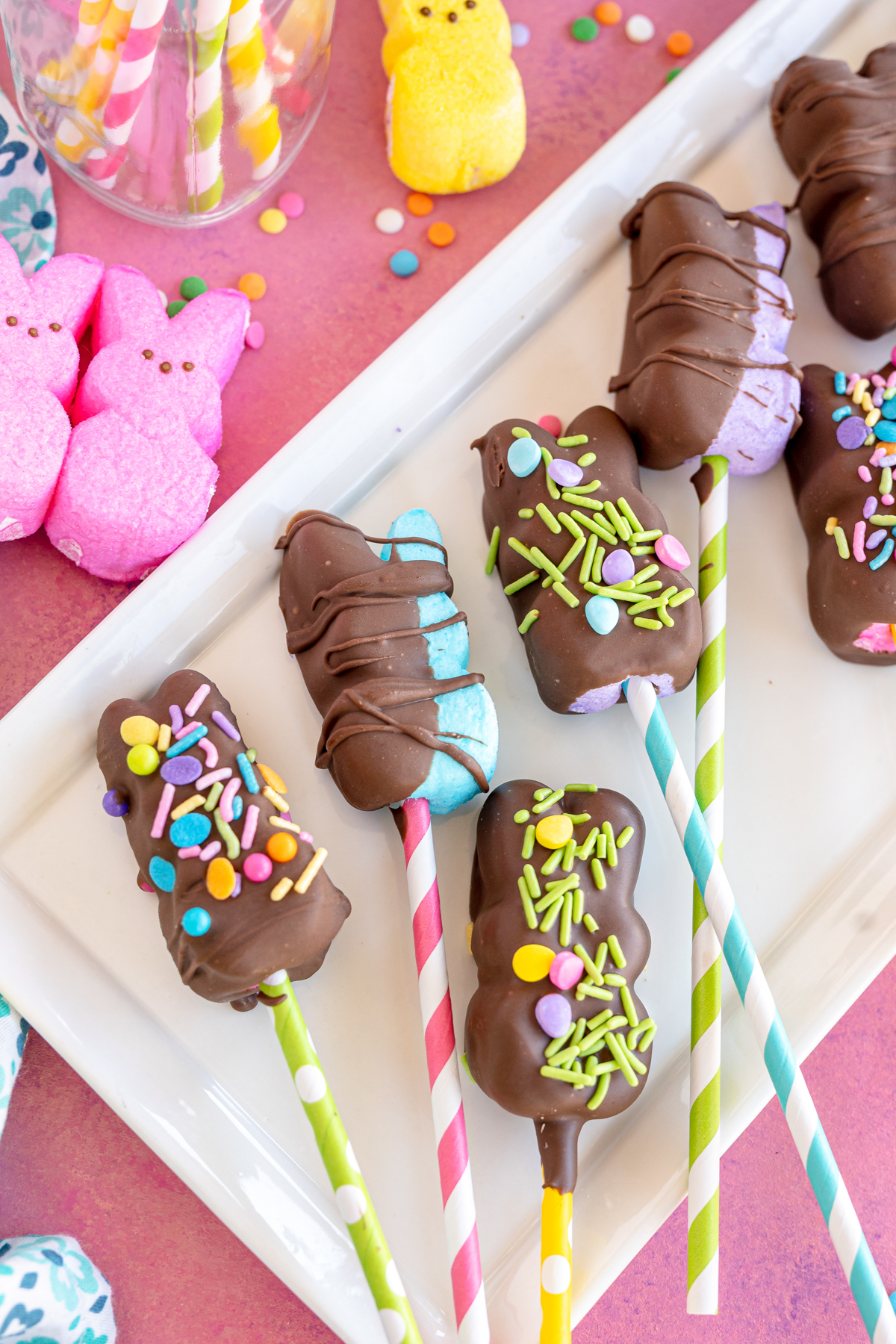 chocolate covered Peeps pops on a white plate