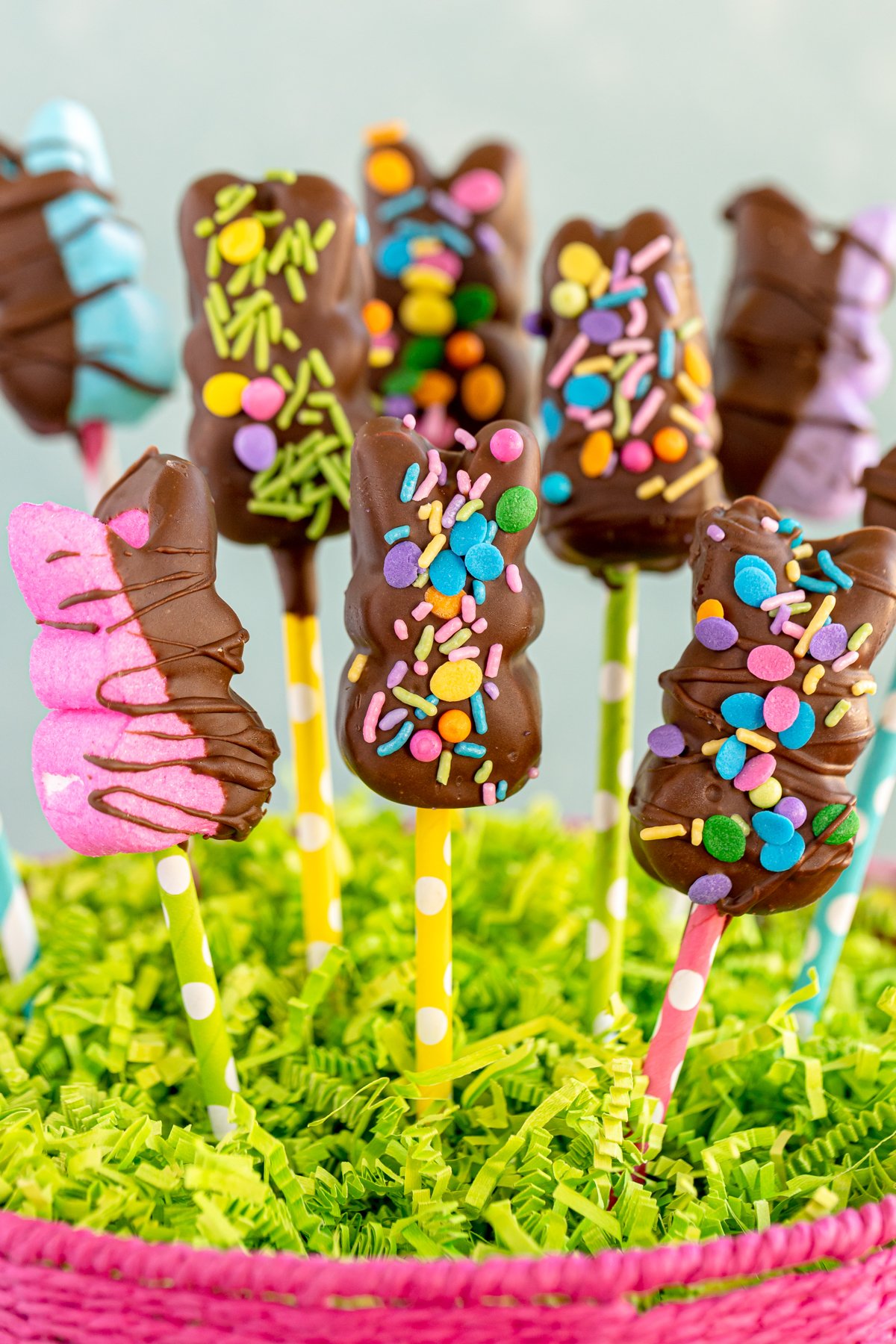 a bunch of chocolate covered Peeps in an Easter basket