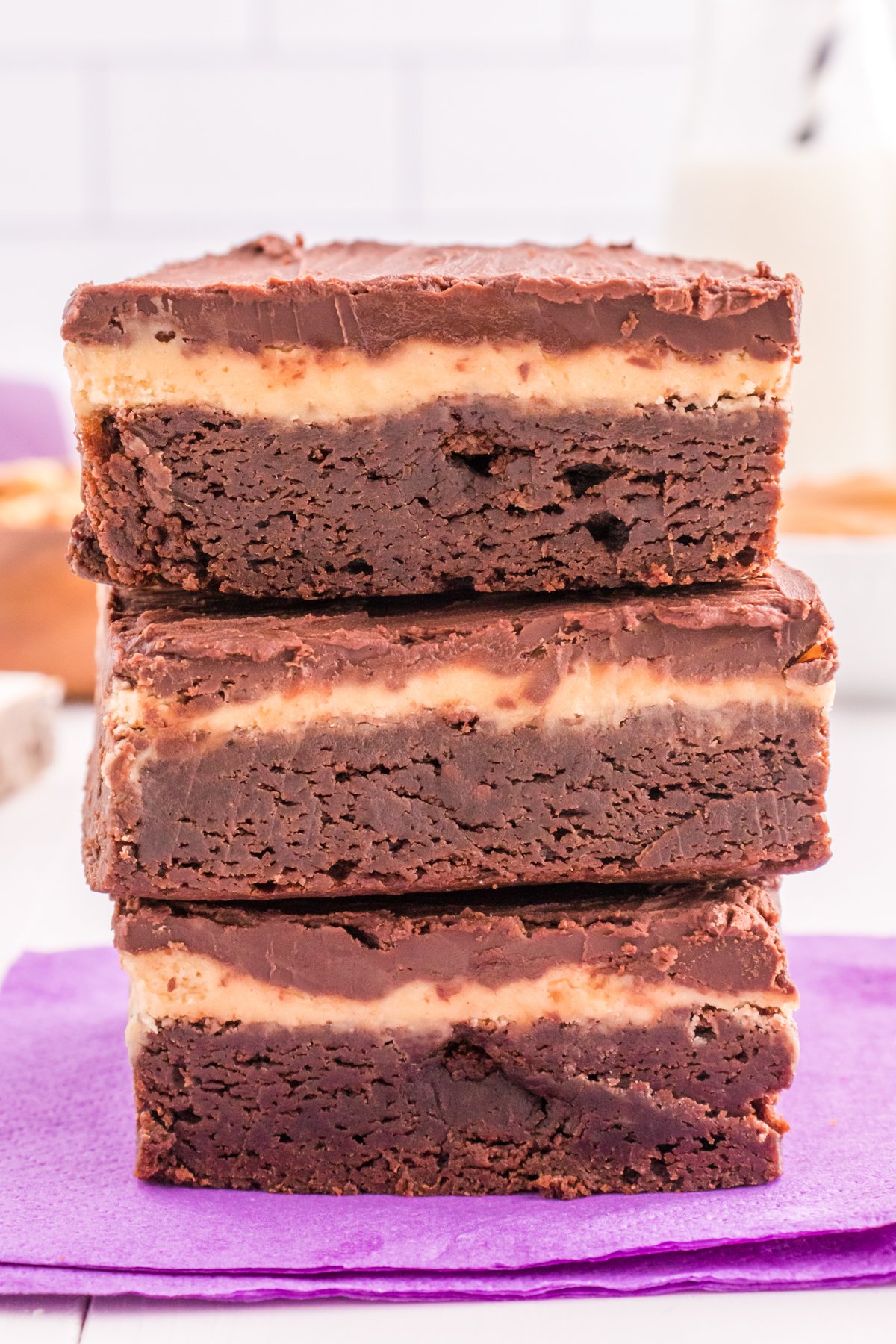 three peanut butter brownies in a stack