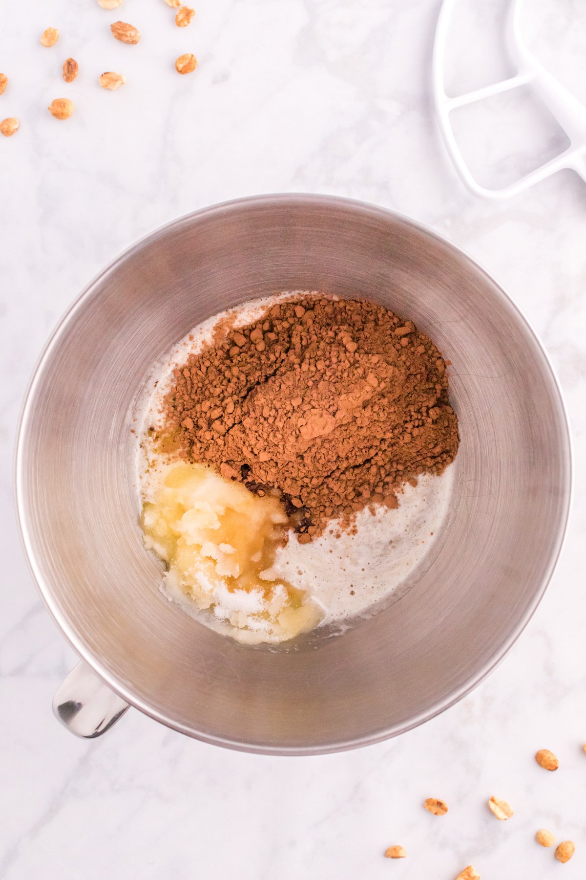 metal bowl with cocoa powder and butter in it