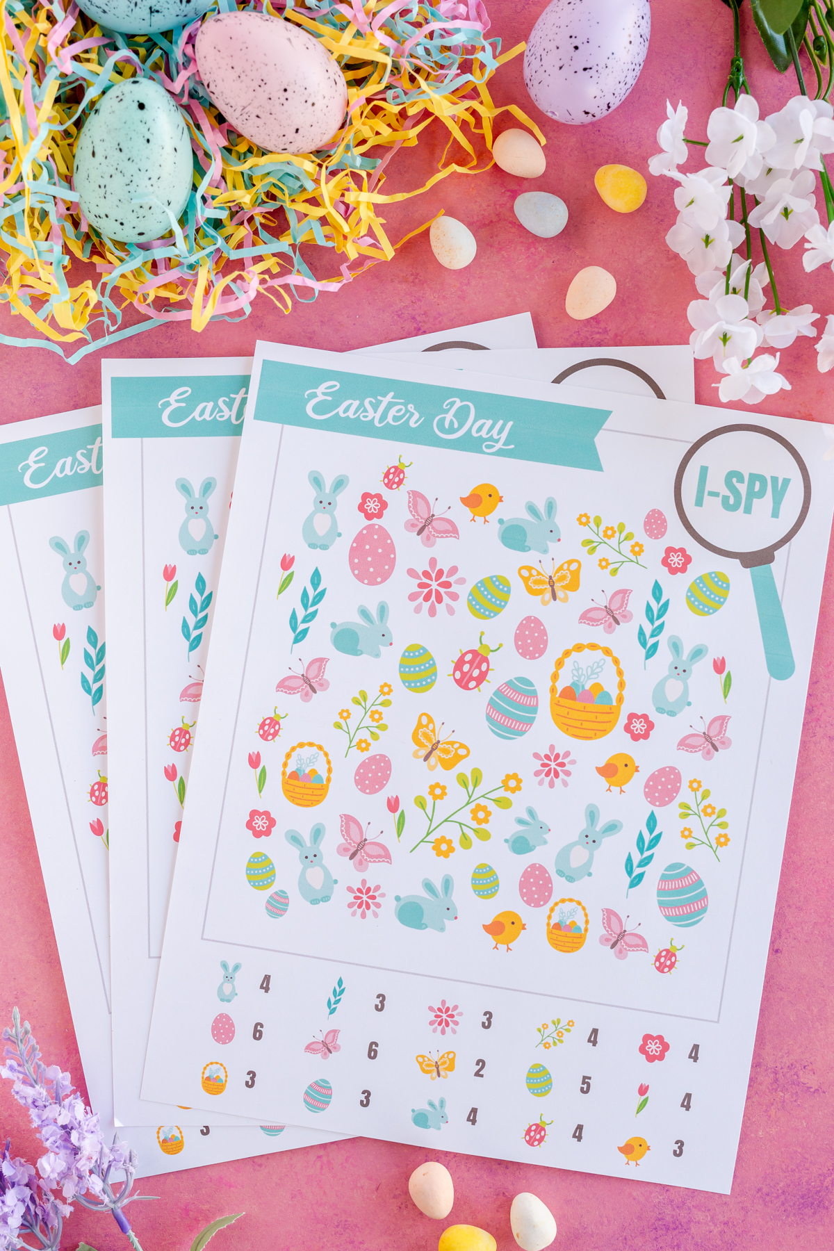 three i spy Easter print outs on top of each other
