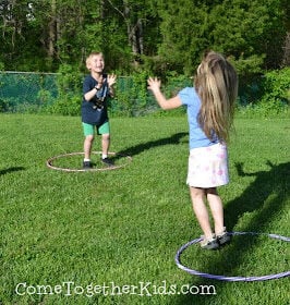 kids standing in hula hoops