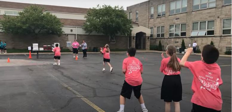 family doing a pizza box relay