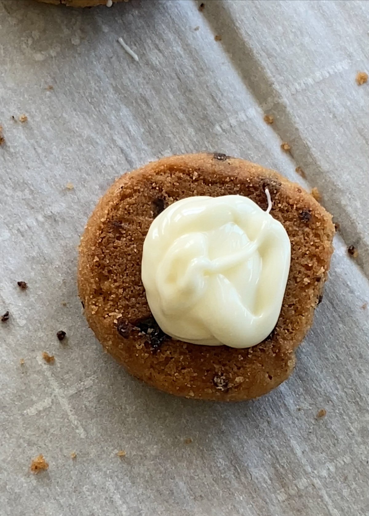 white chocolate piped on a cookie
