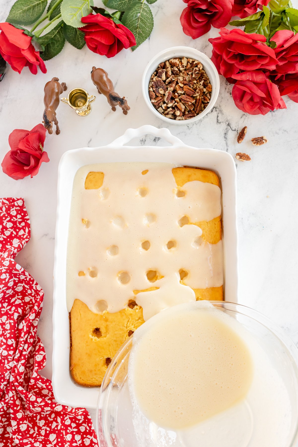 pouring butter glaze over Kentucky butter cake