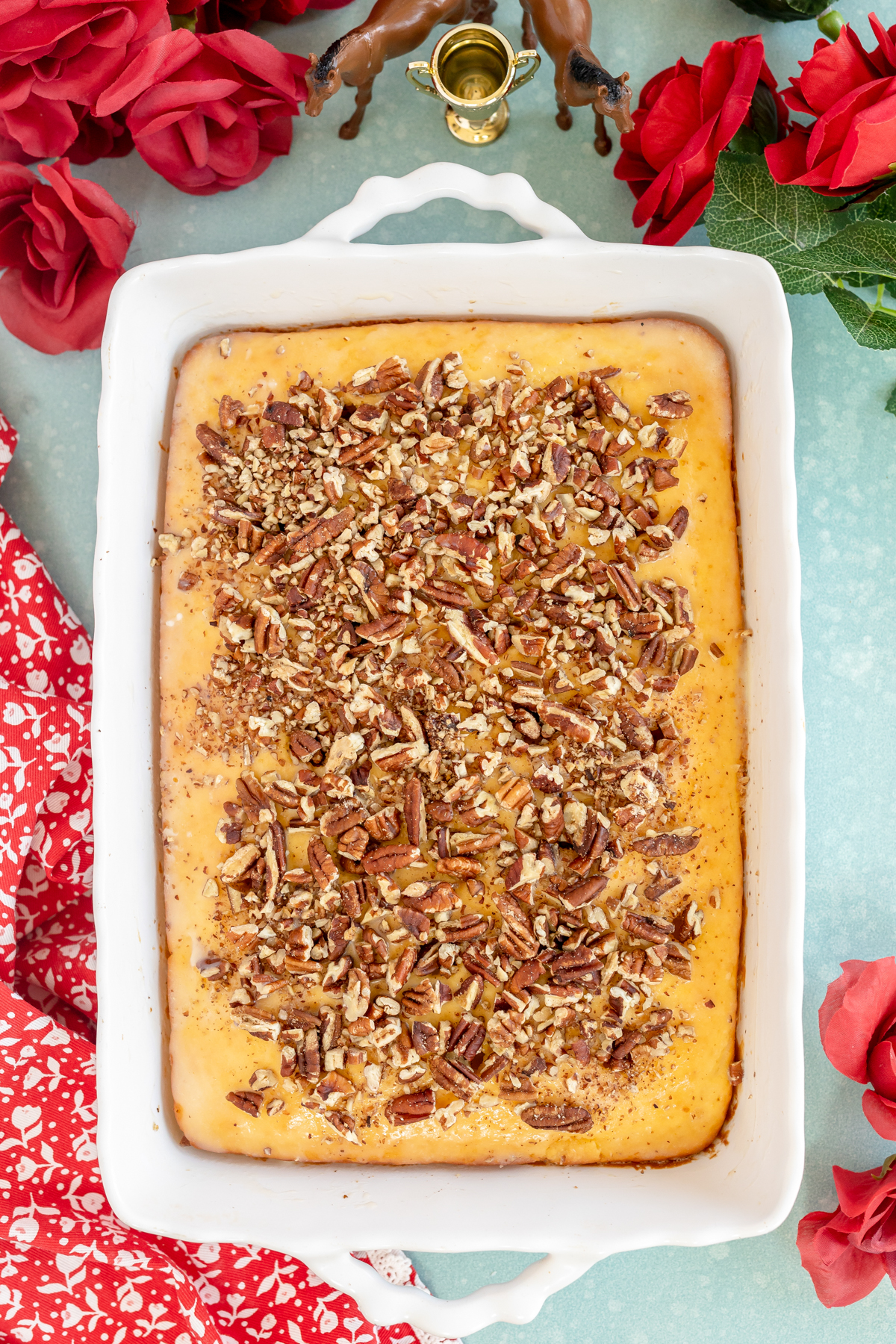 Kentucky butter cake topped with chopped pecans