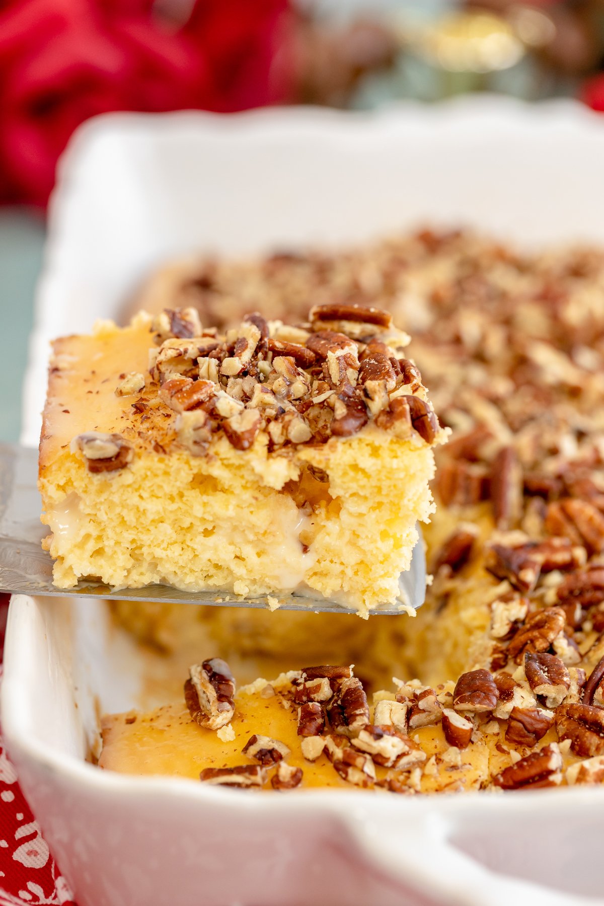 removing a piece of Kentucky Butter Cake from a cake pan