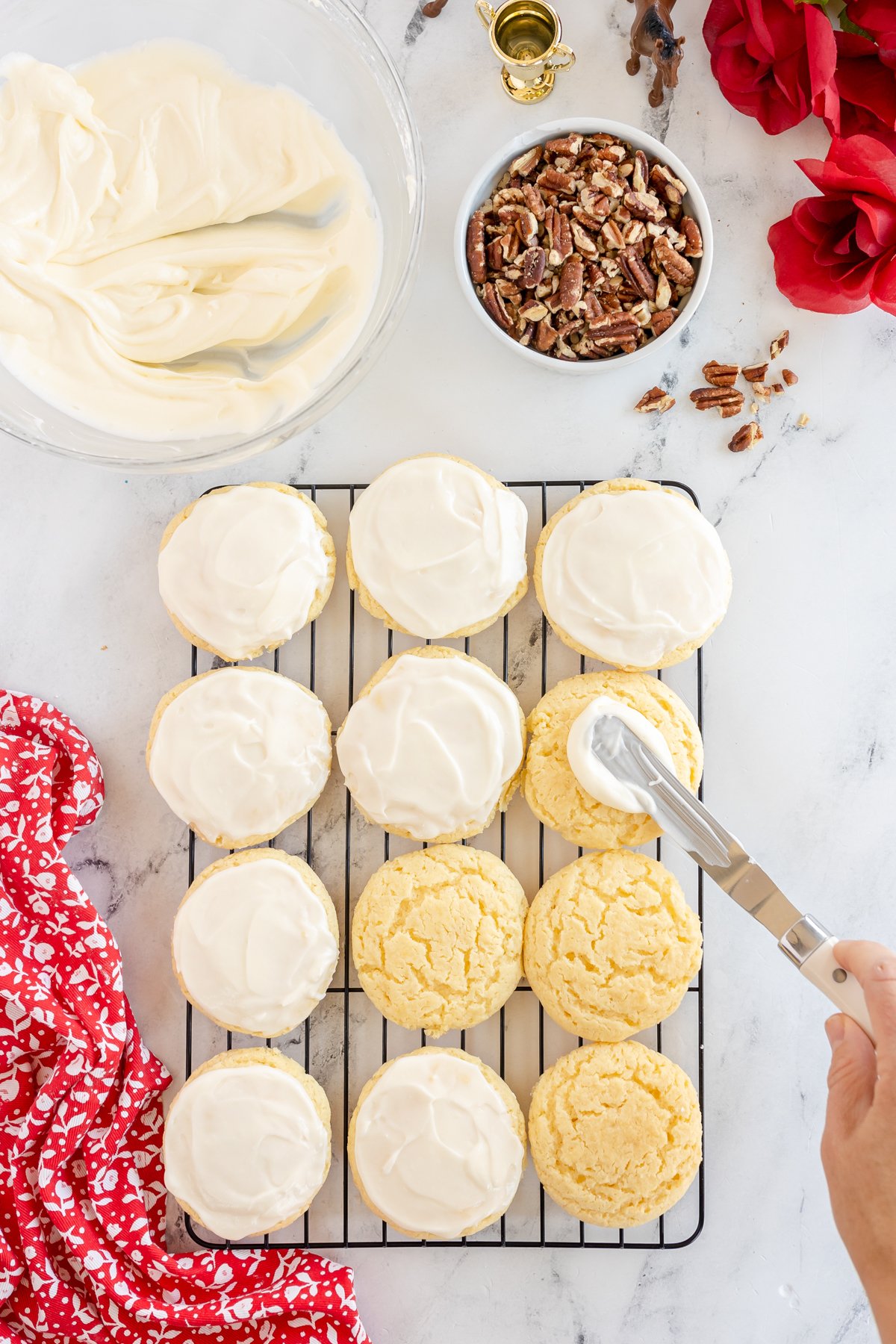 frosting butter cookies with a knife