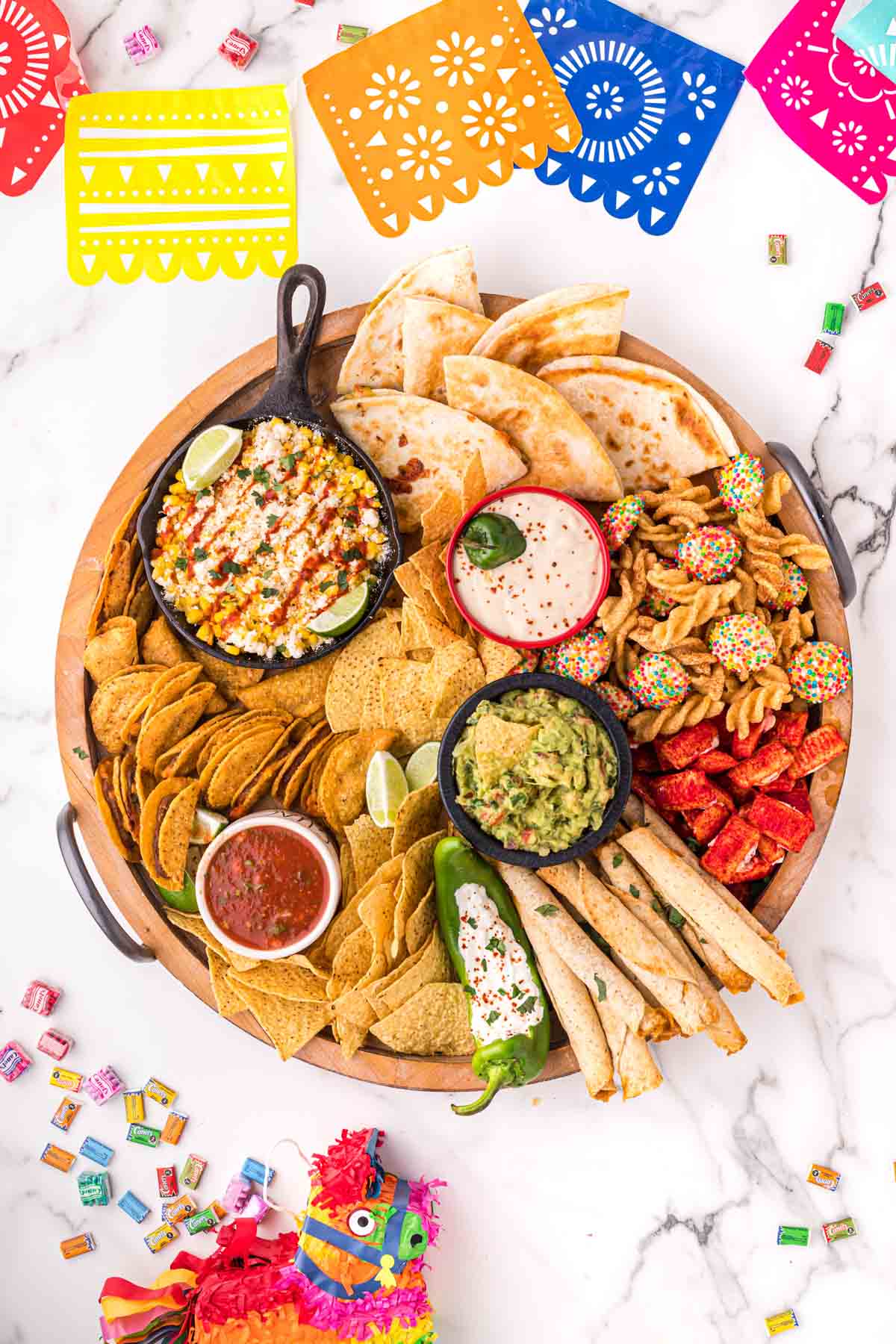 Mexican charcuterie board with fiesta flags around