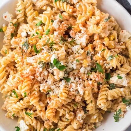 white bowl with Mexican street corn pasta salad