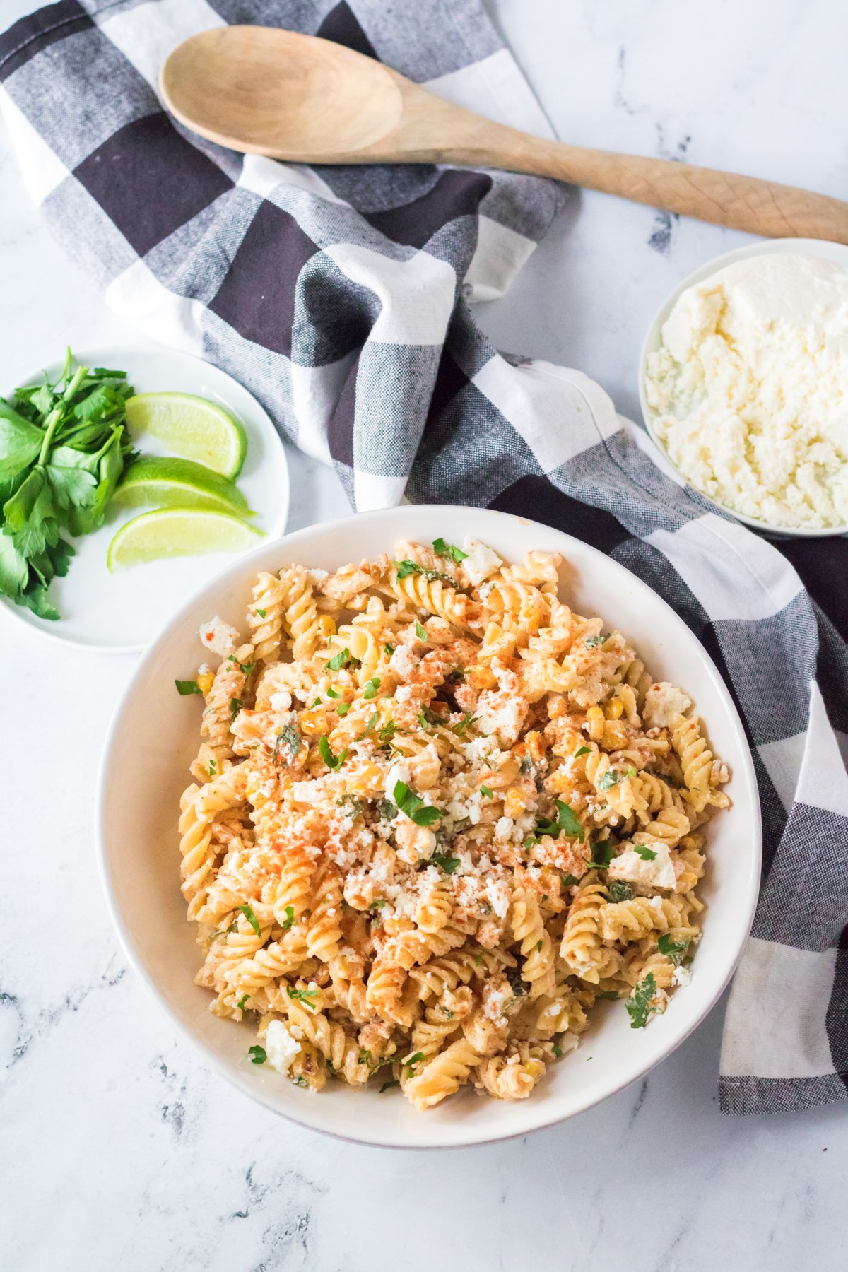 small white bowl with Mexican street corn pasta salad