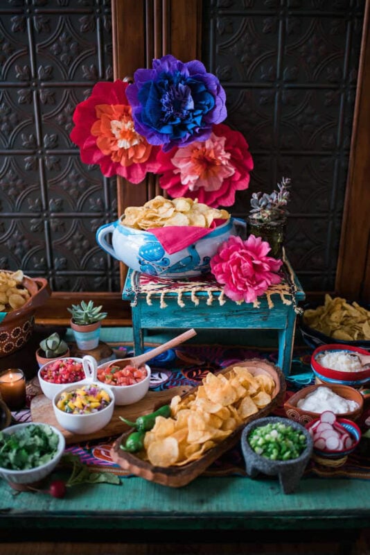 Nacho bar setup with Mexican fiesta decorations