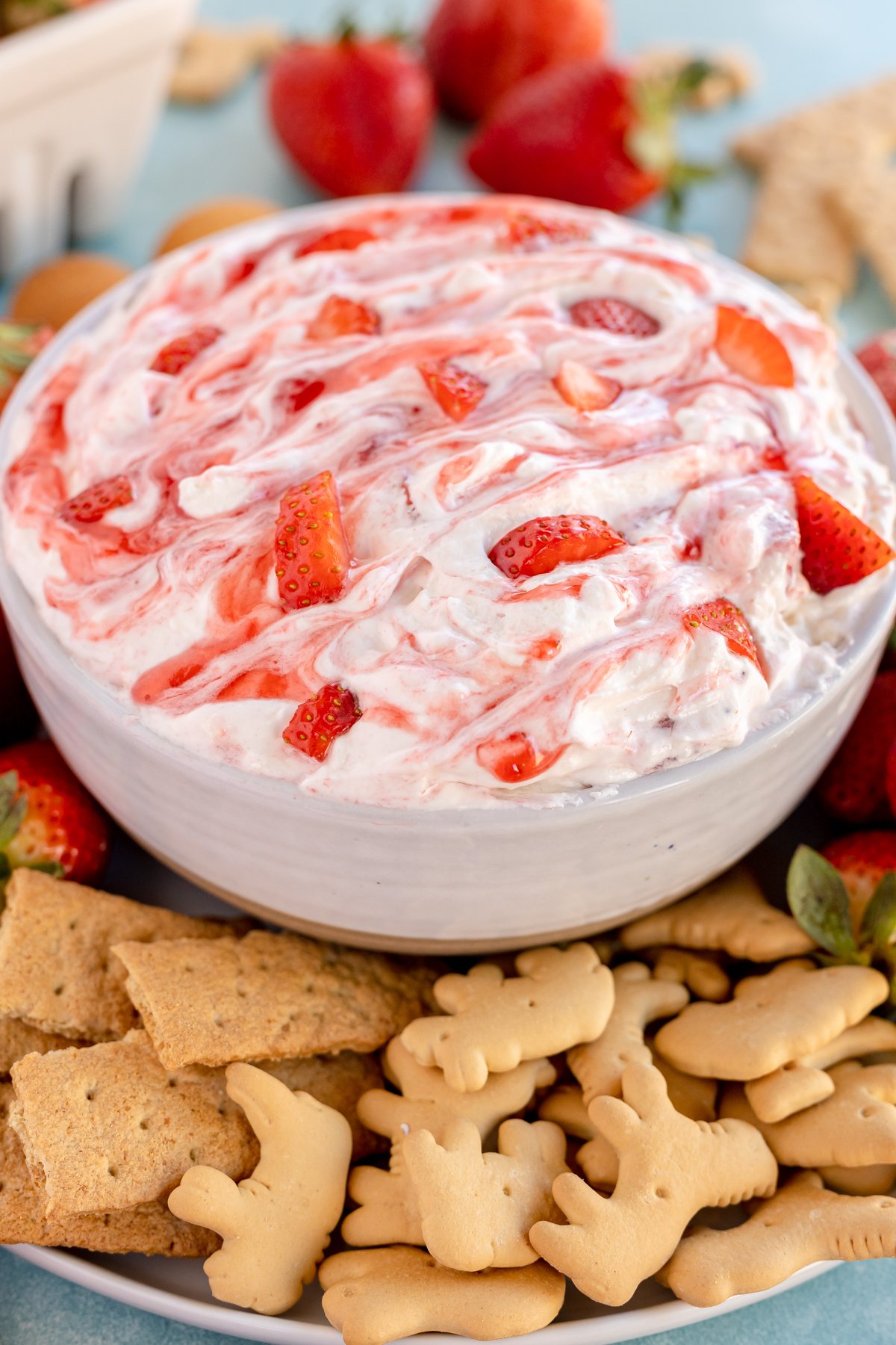 white bowl with strawberry dip and cookies