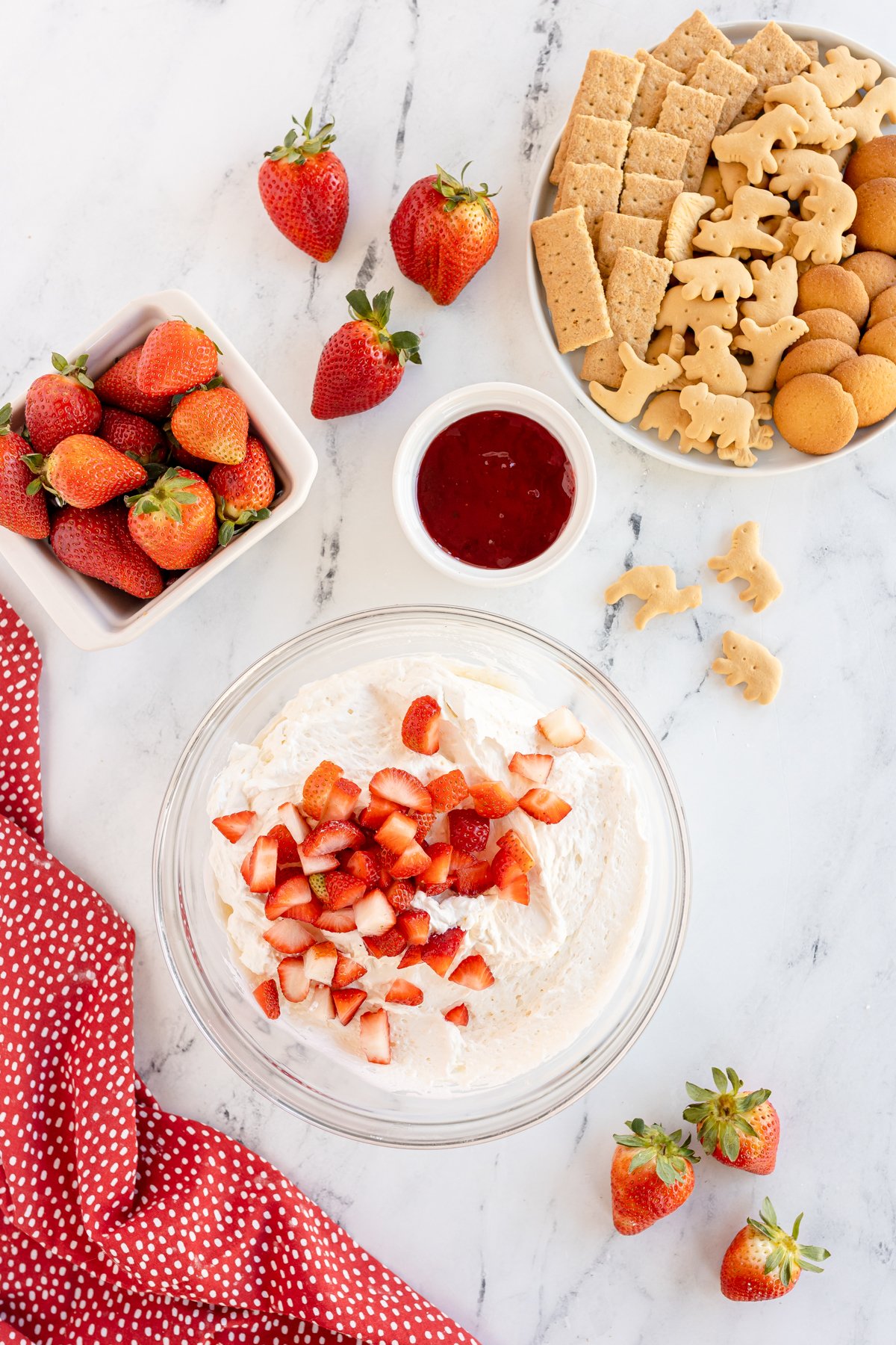 strawberries and cream cheese in a glass bowl