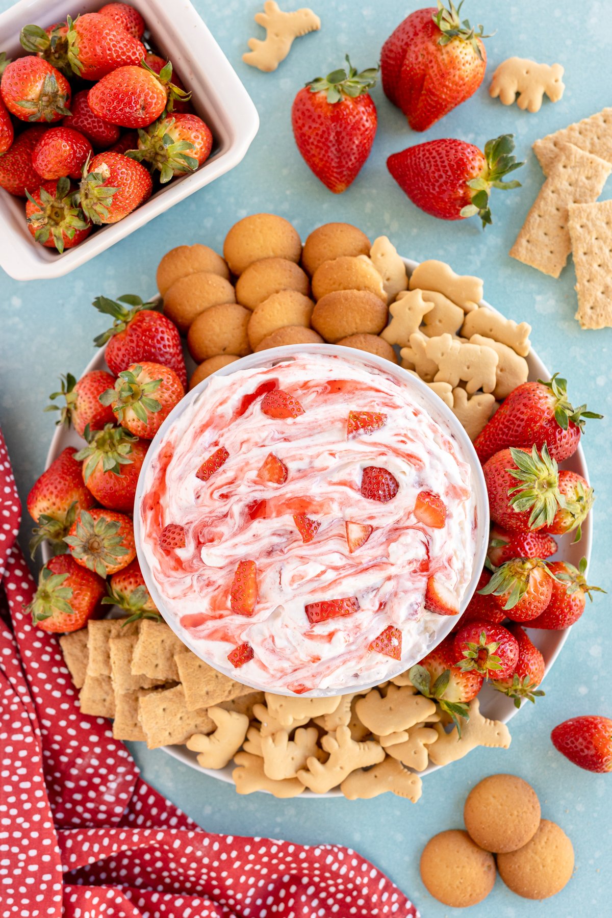 strawberry dip surrounded by crackers and cookies