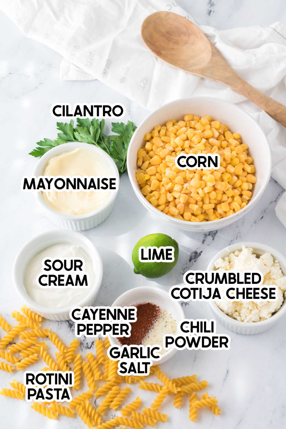 ingredients for a Mexican street corn pasta salad with labels