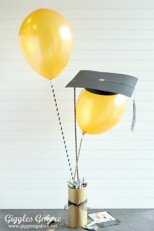 graduation balloons with a cap on top