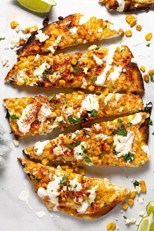 pieces of flatbread with street corn