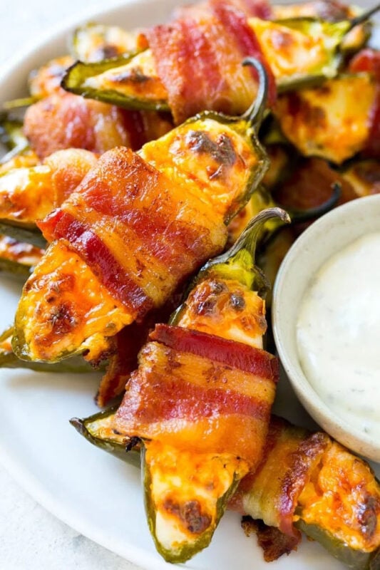 bacon wrapped jalapeno poppers with a cream dip