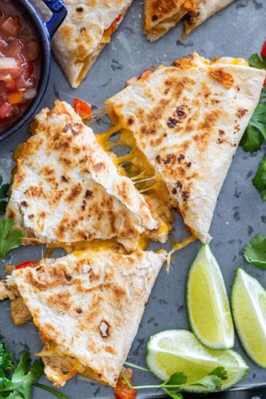 chicken quesadillas with some lime wedges