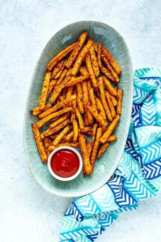 blue bowl full of jicama fries