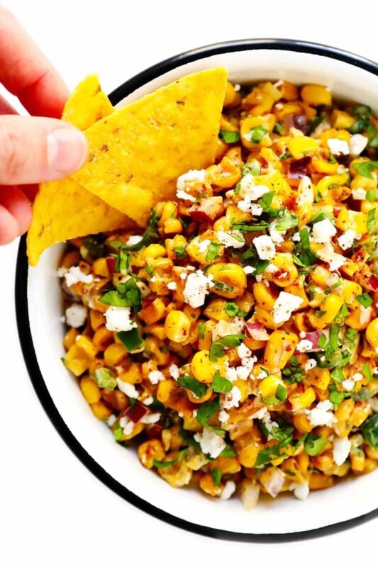 Chips in a bowl of elote dip