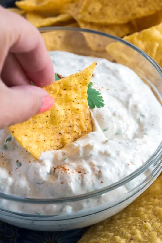 chip dipped in queso fresco dip
