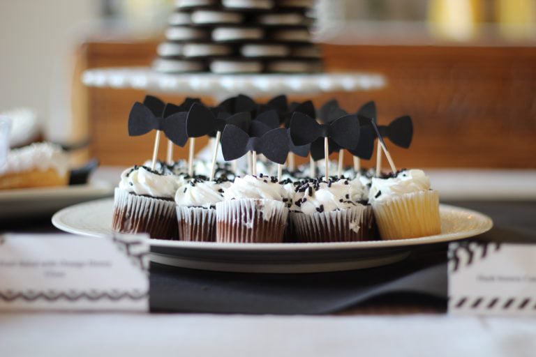 cupcakes with black bow ties on them