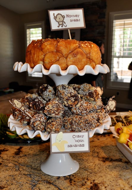 monkey bread and chocolate bananas on a cake stand