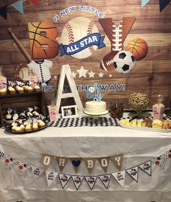 table with lots of balls and sports themed items on it