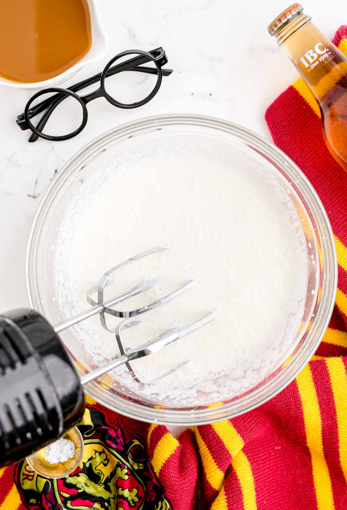 cream and beaters in a glass bowl