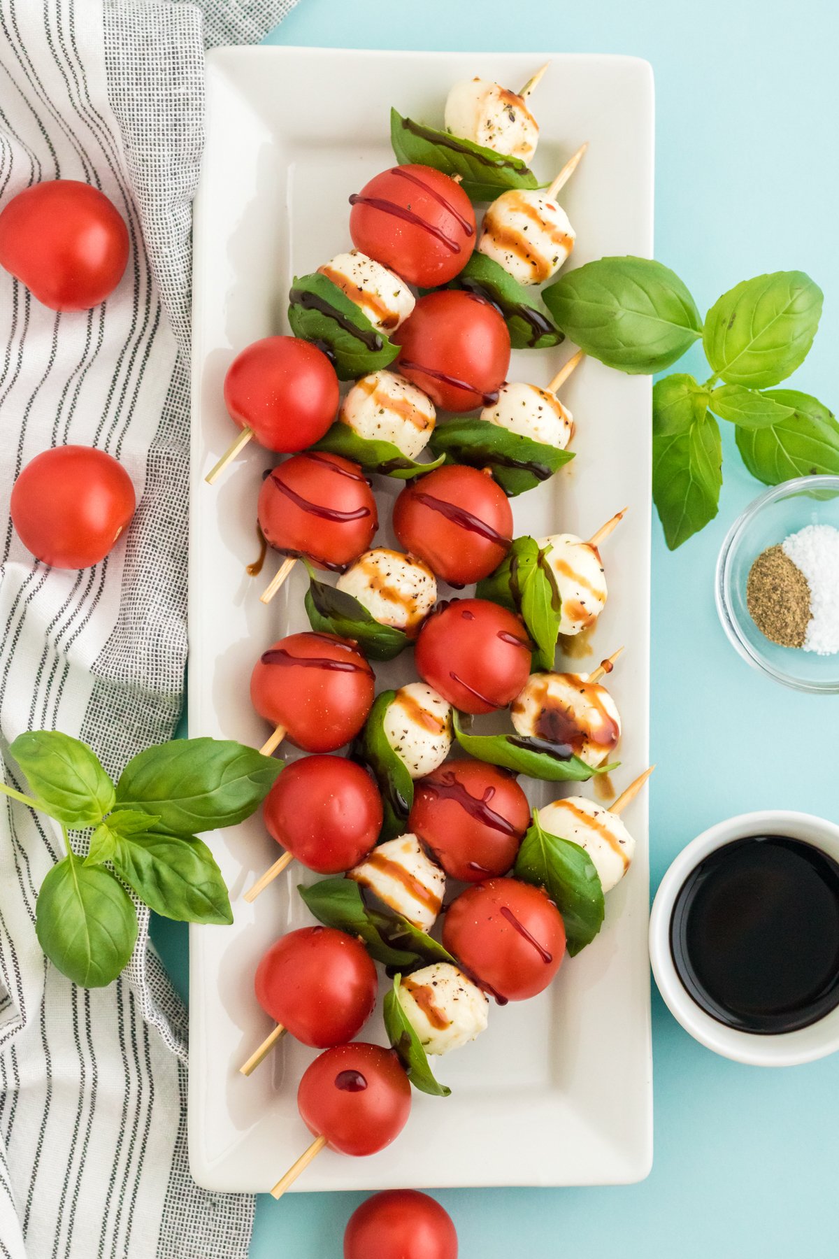 plate full of caprese salad skewers